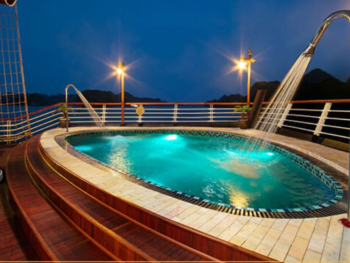 Luxurious onboard pool at night on the Orchid Trendy Cruise, Ha Long Bay, Vietnam - Perfect for relaxation and enjoying the scenic views