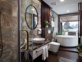 Luxurious bathroom with a view on the Orchid Trendy Cruise, Ha Long Bay, Vietnam - Featuring a spacious bathtub and elegant design